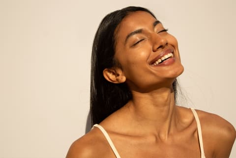 Confident Woman Sunbathing Isolated Portrait