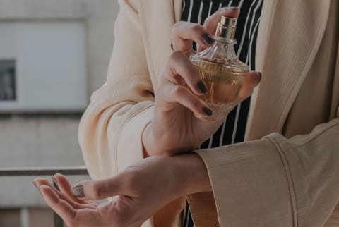 Anonymous Woman Spraying On Perfume