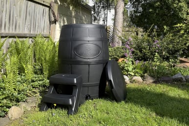 Ice Barrel 400 in bright green backyard of tester with stairs in front of barrel and lid on the side