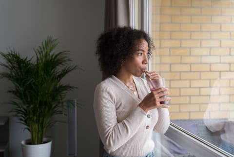 woman drinking smoothie